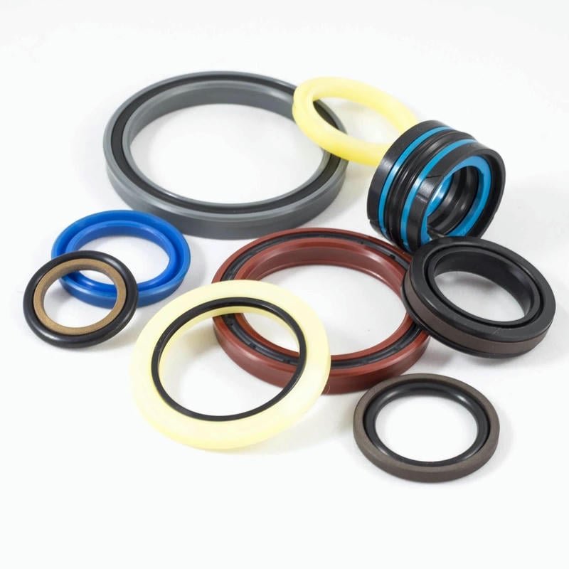 Close-up detail of advanced composite materials used in our high-performance hydraulic cylinder piston seals, highlighting multi-layer construction and specialized lip design.