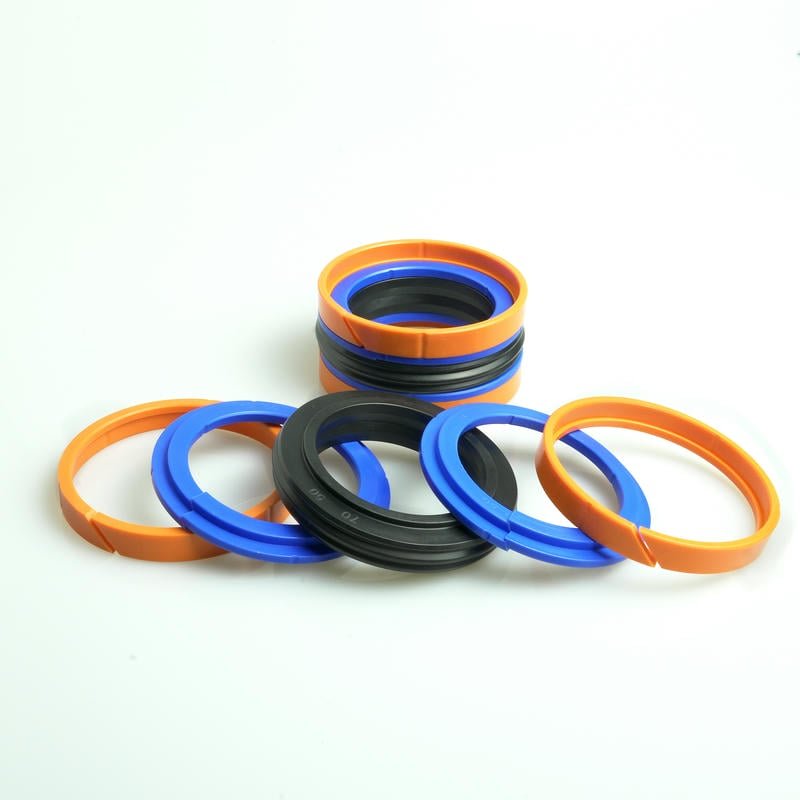 Industrial testing of hydraulic cylinder piston seals under extreme pressure and temperature conditions, showing superior performance of our seals compared to standard industry options.