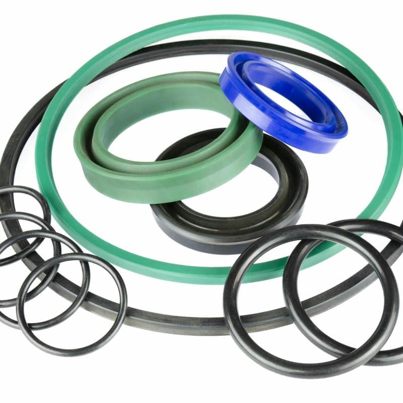 Comparison image showing a new, intact hydraulic cylinder piston seal versus a worn or damaged one.